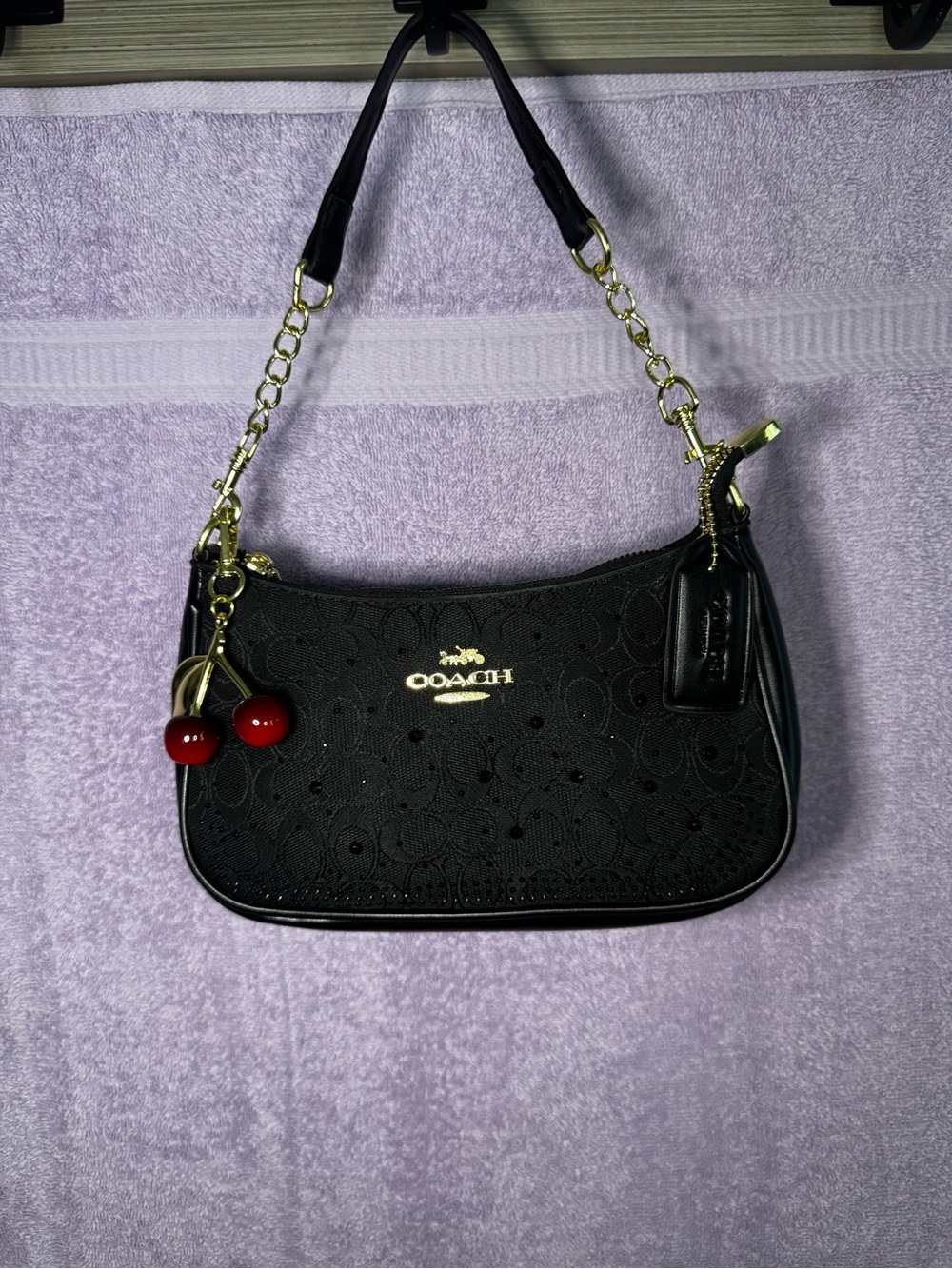 Coach Black Shoulder Bag with Red Cherry Charm and Gold Hardware